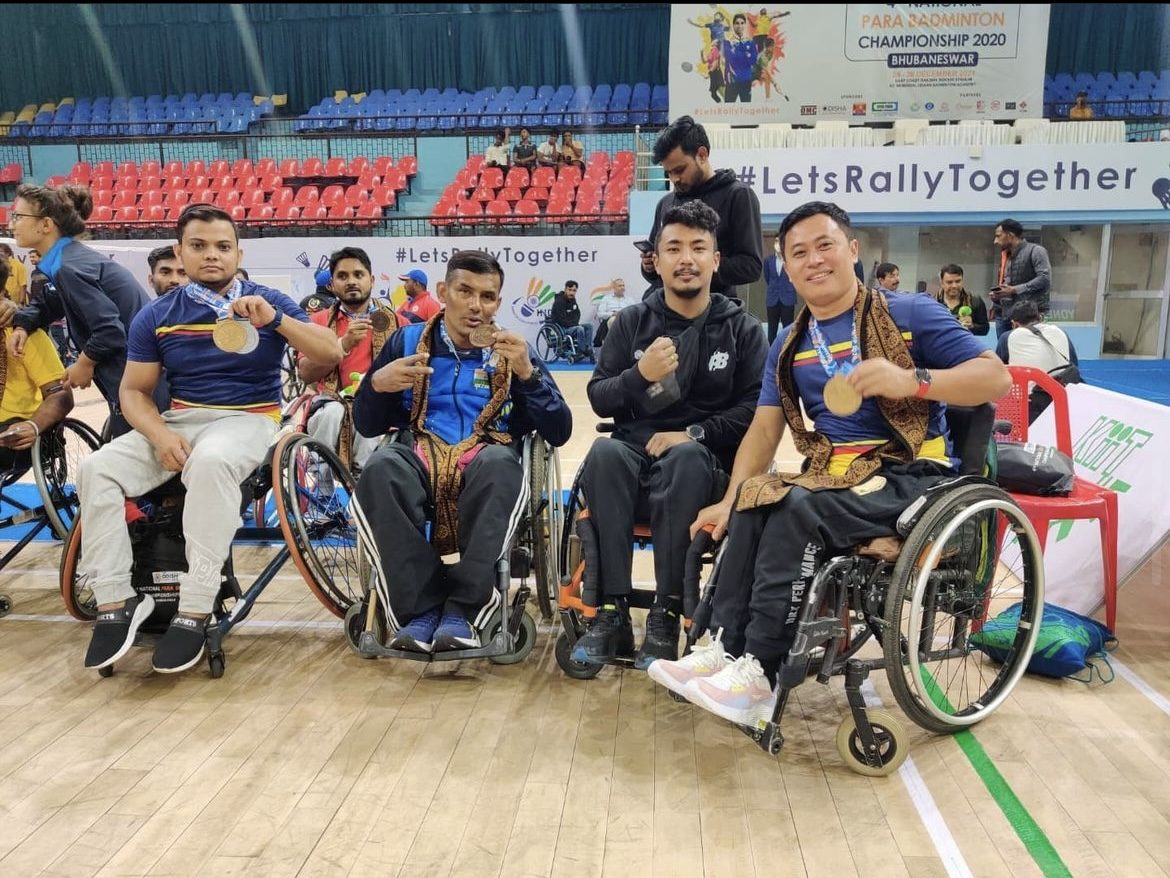 Team of wheelchair athletes in a stadium