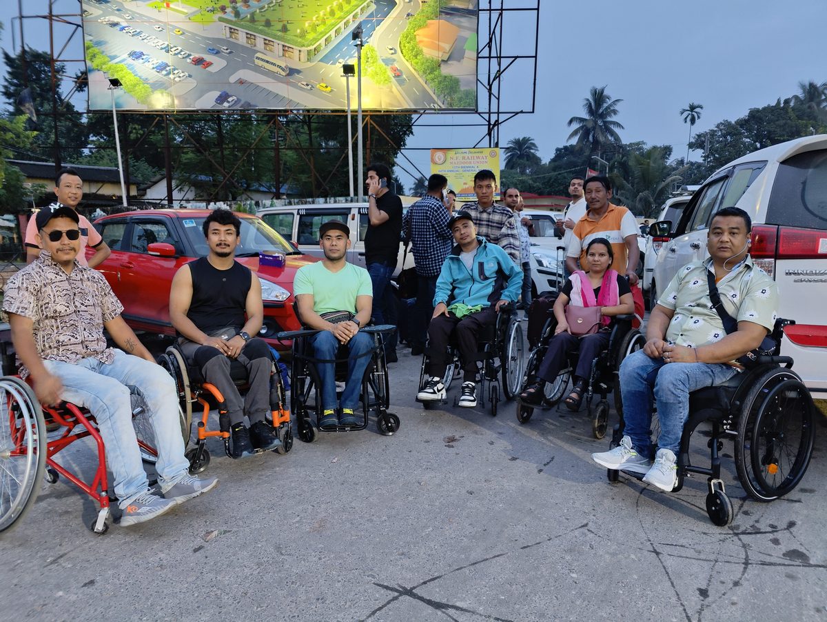 Wheelchair users gathered outside before travel
